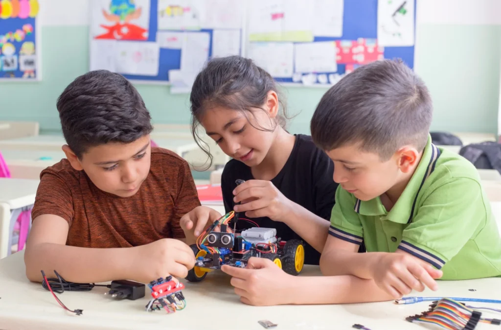 Students developing a robot in the classroom